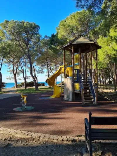 children's play area in the Barcola pine forest, just a few meters from the Sogno sul Mare vacation apartments