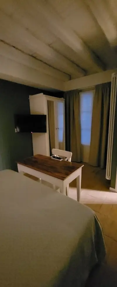 Small apartment TV and small table in the bedroom